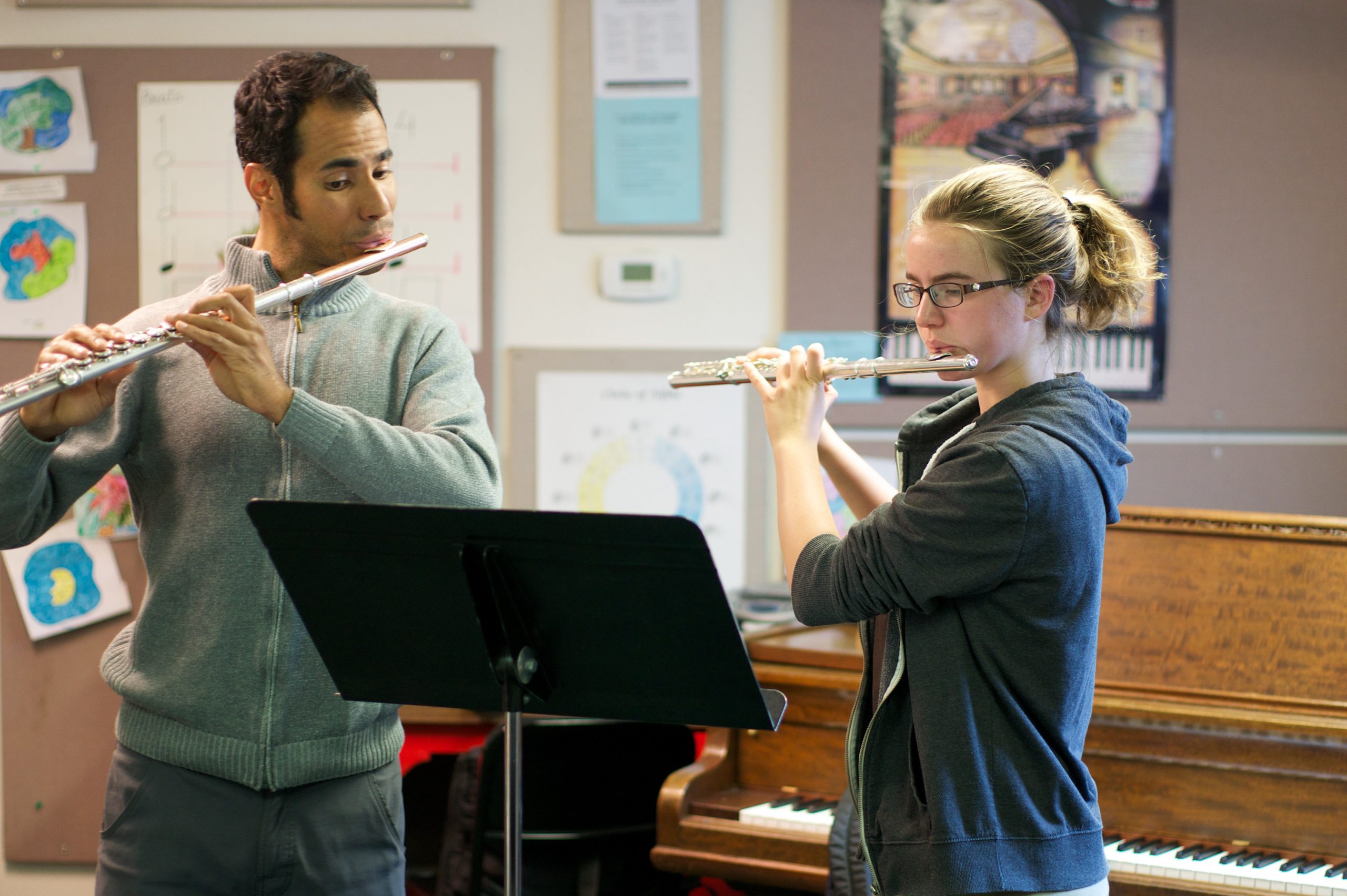 Flute lessons - two people playing the flute, student and teacher