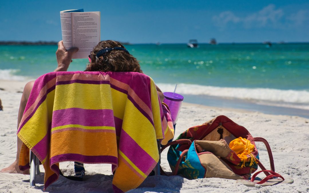Reading books about music on the beach in the summer