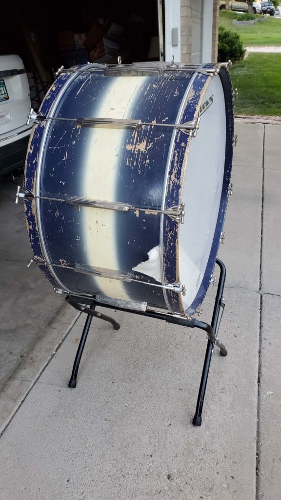 Old bass drum that needs refurbishing and repairing
